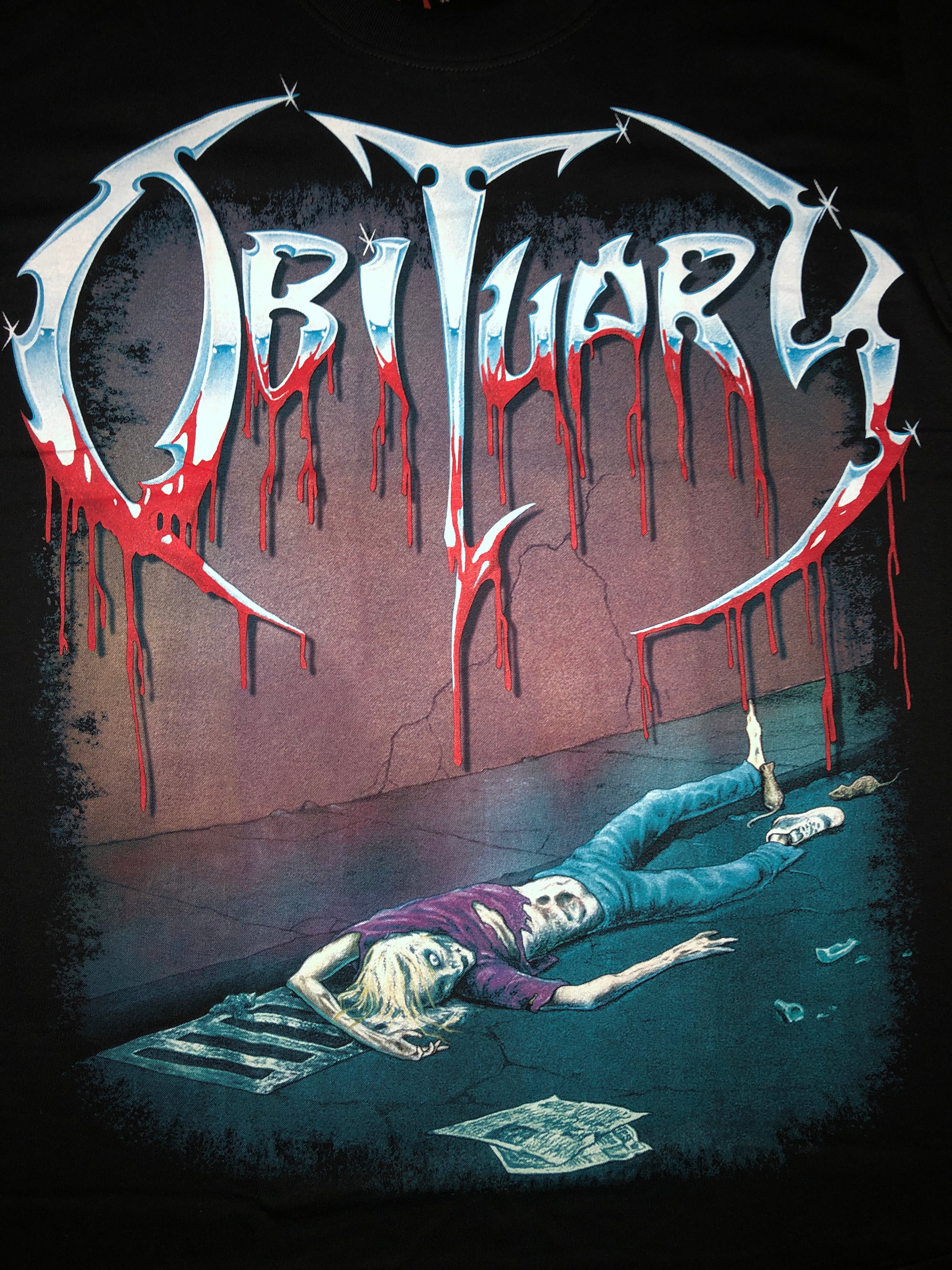 Obituary - Slowly We Rot Secondary image